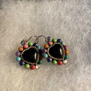 Black heart shaped pierced earrings